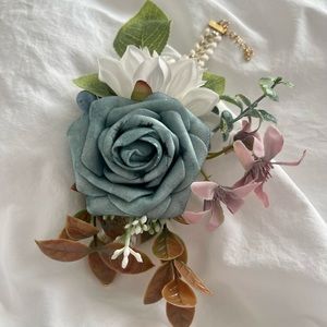Wrist Corsage Bracelet with blue, teal, lavender, and white flowers and berries